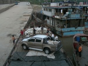 I'm sure the boat was full but let's just see if we can squeeze a SUV on too