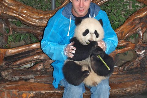 Holding a panda in chengdu