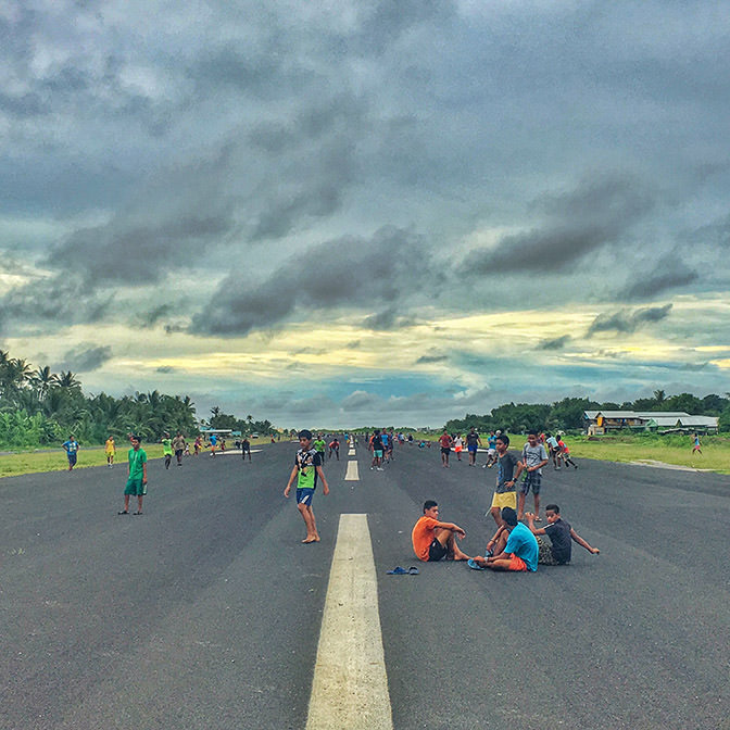Kids on a runway in Tuvalu