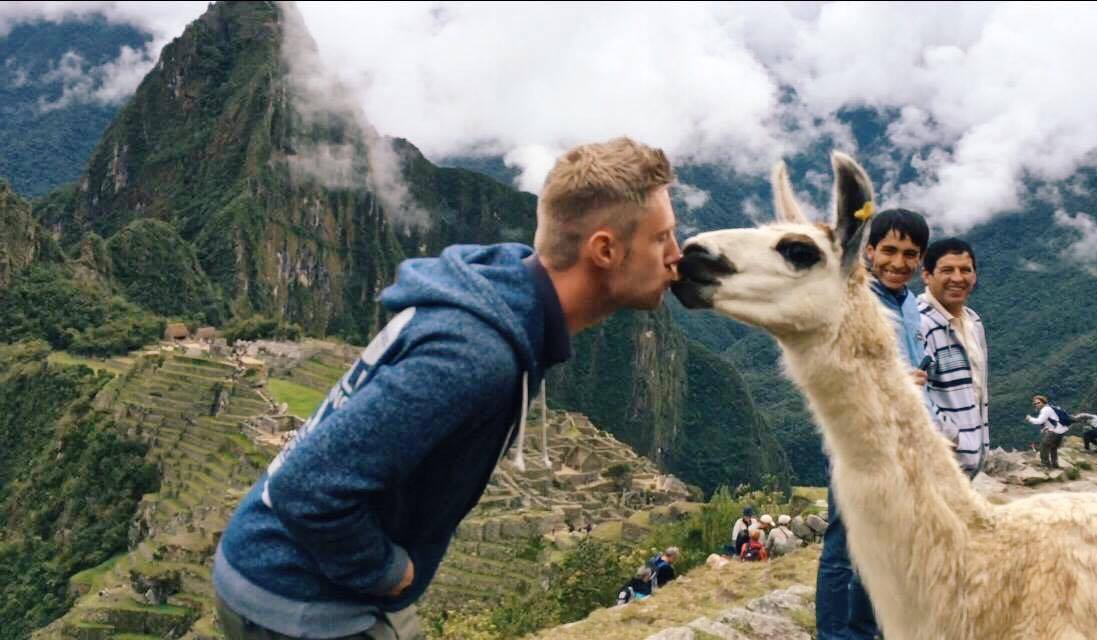 Kissing a llama at Machu Picchu